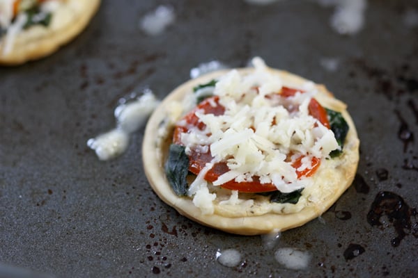Adding grated cheese on top of these mini appetizers makes them delicious!