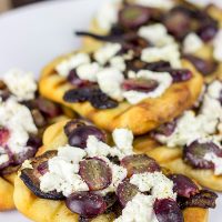 Grilled Goat Cheese Flatbread with Caramelized Onions + Roasted Red Grapes