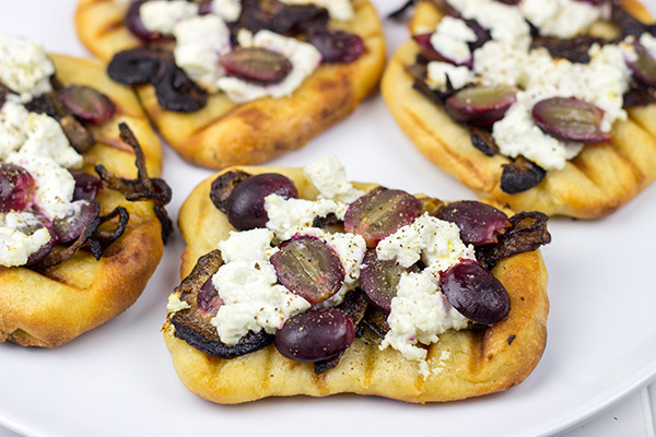 Grilled Goat Cheese Flatbread with Caramelized Onions + Roasted Red Grapes