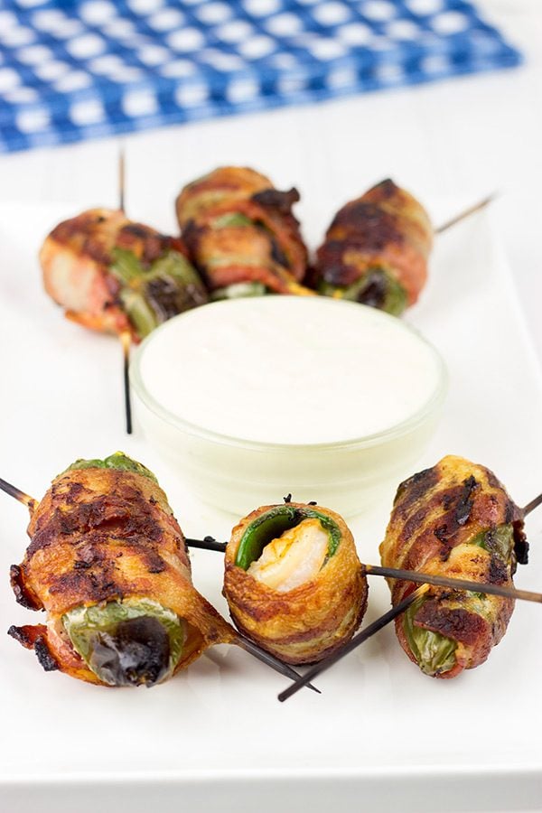 Grilled Jalapeno Poppers: These jalapenos are stuffed with shrimp and wrapped with bacon to create the PERFECT summer grilled appetizer!