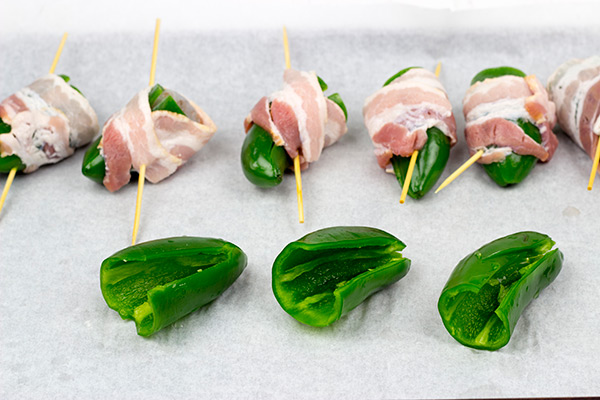 Grilled Jalapeno Poppers: These jalapenos are stuffed with shrimp and wrapped with bacon to create the PERFECT summer grilled appetizer!