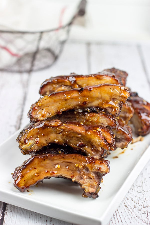 Nothing says summer like grilling ribs in your backyard. These Sweet Chili Glazed Baby Back Ribs offer a fun twist on an American classic!