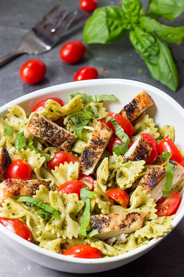 This Pesto Pasta Salad with Grilled Chicken is an easy and delicious weeknight meal. Serve it cold as a summer pasta salad or hot as a delicious winter entree!