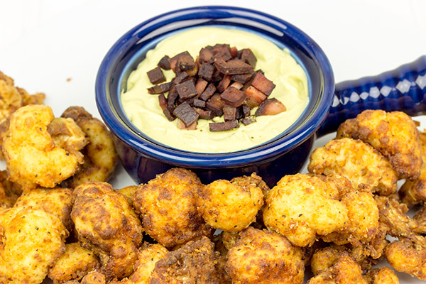 This Fried Cauliflower is paired with a Spicy Avocado Cream to create one delicious appetizer!