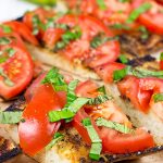 Instead of toasting bread, throw it on the grill! This Grilled Bruschetta makes for the perfect summer appetizer (or dinner)!