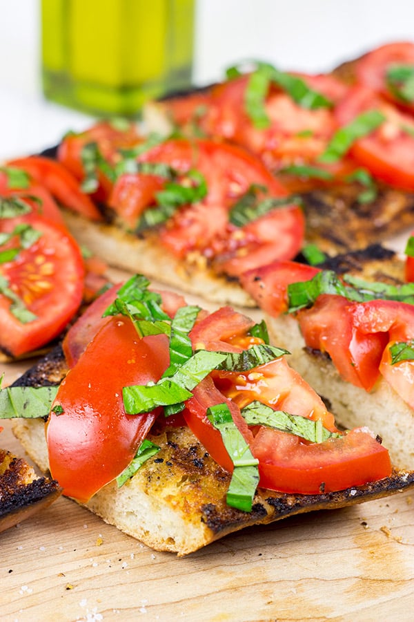 Instead of toasting bread, throw it on the grill! This Grilled Bruschetta makes for the perfect summer appetizer (or dinner)!