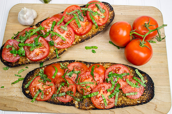 Instead of toasting bread, throw it on the grill! This Grilled Bruschetta makes for the perfect summer appetizer (or dinner)!