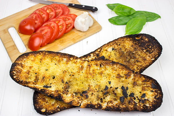 Instead of toasting bread, throw it on the grill! This Grilled Bruschetta makes for the perfect summer appetizer (or dinner)!