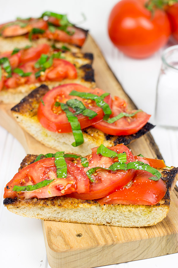 Instead of toasting bread, throw it on the grill! This Grilled Bruschetta makes for the perfect summer appetizer (or dinner)!