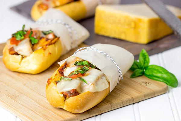 This Grilled Chicken Parm Sandwich is covered with pasta sauce and melted cheese to create a lighter version of a classic sandwich! #shop