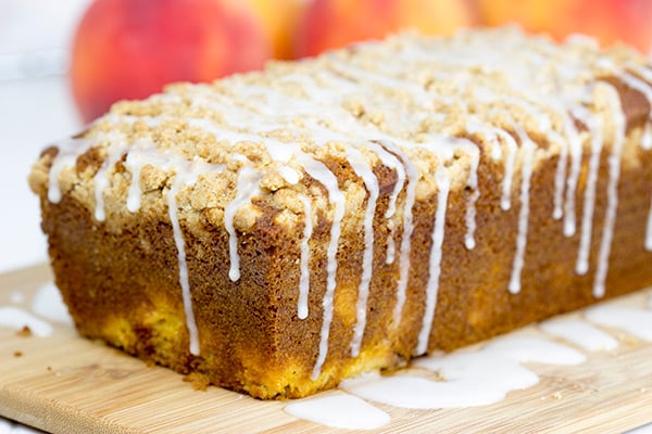 This Peach Crumble Bread is loaded with diced peaches and topped with a brown sugar cinnamon crumble. A slice of this bread is the perfect way to start a warm summer morning! #WalmartProduce