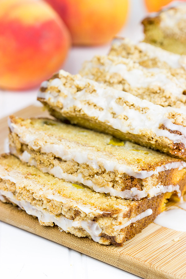 This Peach Crumble Bread is loaded with diced peaches and topped with a brown sugar cinnamon crumble. A slice of this bread is the perfect way to start a warm summer morning! #WalmartProduce