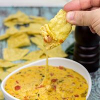 Imagine a creamy, cheesy queso dip...and then add in a smoky grilled flavor! This Smoked Chili con Queso is the perfect appetizer to enjoy during the big game!