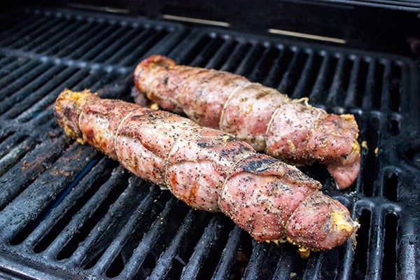 Stuffed with crispy bacon, diced jalapenos and cream cheese, these Bacon & Jalapeno Stuffed Grilled Pork Tenderloins are a delicious grilled game day treat!