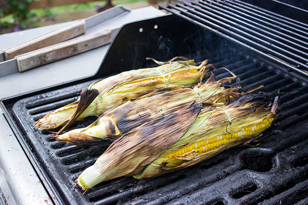 This Mexican Street Corn is covered in crema, grated Parmesan, lime juice and feta cheese. It's messy...and VERY tasty!