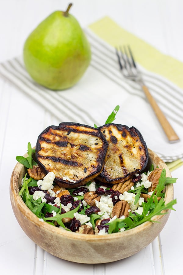 This Grilled Pear, Gorgonzola and Pecan Arugula Salad is surprisingly easy to make. Top it with a tasty, homemade Honey Balsamic Dressing for an extra boost of flavor!