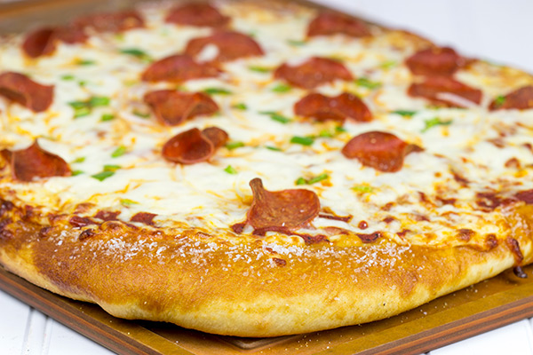 Is it a pretzel or a pizza? It's both! This Pretzel Crust Pizza is the perfect weekend meal for watching the big game!