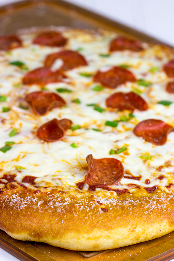 Is it a pretzel or a pizza? It's both! This Pretzel Crust Pizza is the perfect weekend meal for watching the big game!