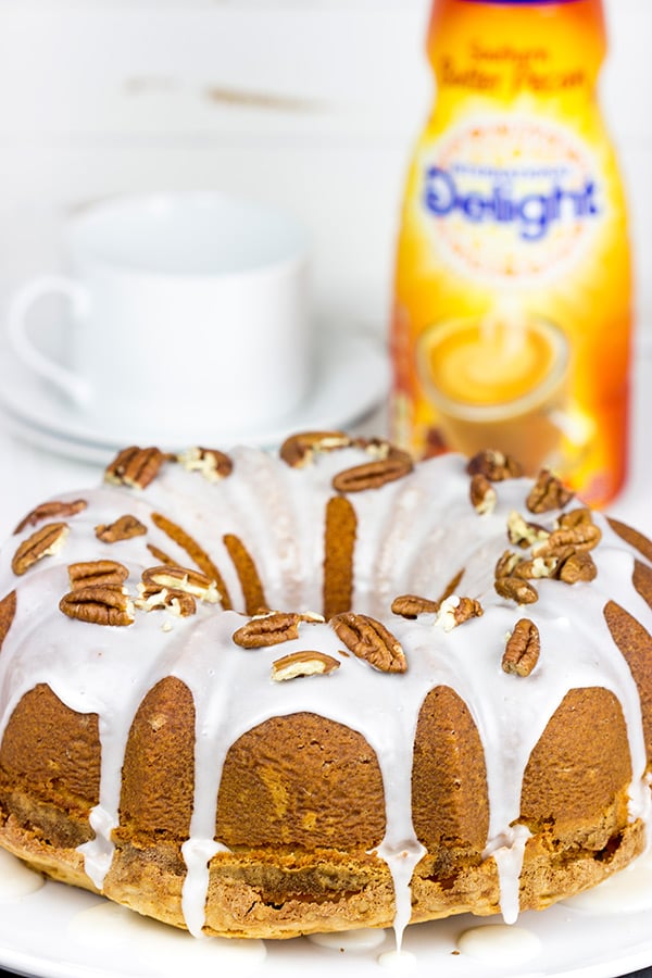 Topped with a toasted pecans and a delicious glaze, this Butter Pecan Pound Cake is the perfect sweet treat for a cool Autumn evening! #IDelight