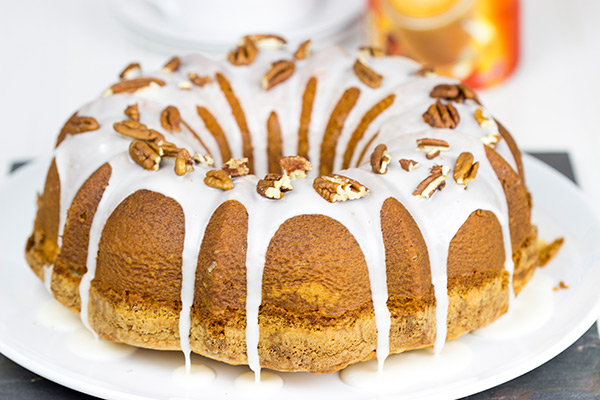 Topped with a toasted pecans and a delicious glaze, this Butter Pecan Pound Cake is the perfect sweet treat for a cool Autumn evening! #IDelight