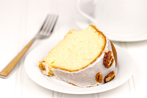 Topped with a toasted pecans and a delicious glaze, this Butter Pecan Pound Cake is the perfect sweet treat for a cool Autumn evening! #IDelight