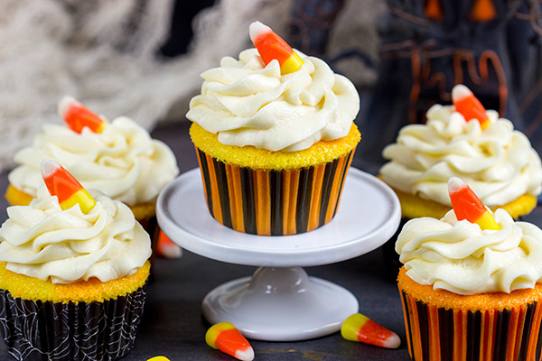 A bit of yellow and orange food coloring turns these classic vanilla cupcakes into Candy Corn Cupcakes. They're perfect for Halloween!