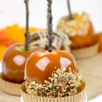 Homemade caramel apples are an easy and fun seasonal treat! Grab some juicy apples and top them with caramel, chocolate and chopped nuts.