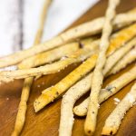 These Kalamata Olive and Sea Salt Grissini (i.e. breadsticks) are the perfect pre-dinner appetizer!