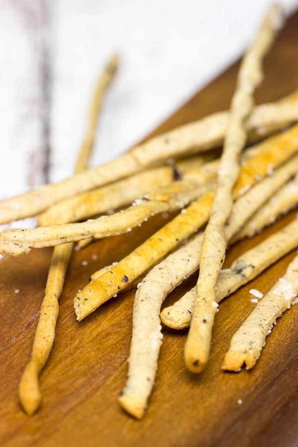 These Kalamata Olive and Sea Salt Grissini (i.e. breadsticks) are the perfect pre-dinner appetizer!