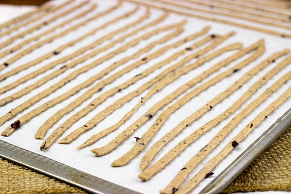 These Kalamata Olive and Sea Salt Grissini (i.e. breadsticks) are the perfect pre-dinner appetizer!