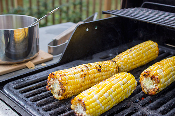 This Spicy Maple Grilled Corn is brushed with a delicious hot sauce + maple syrup combo. It's the perfect side dish for the grill!