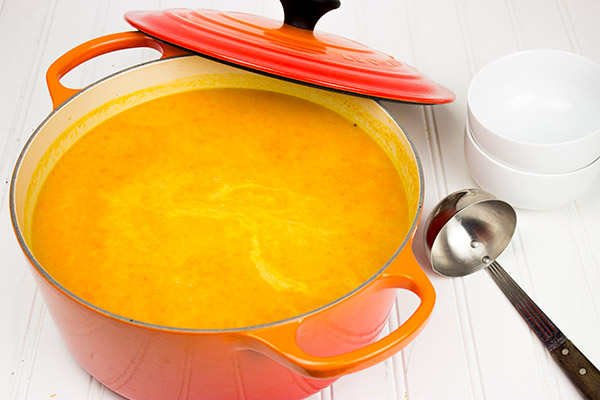 This Creamy Carrot and Sweet Potato Soup is a quick and healthy recipe that'll warm you up on chilly winter days!