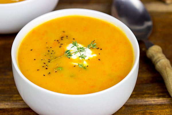 This Creamy Carrot and Sweet Potato Soup is a quick and healthy recipe that'll warm you up on chilly winter days!