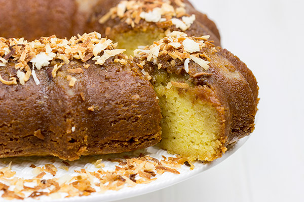 Soaked overnight in dark rum and then topped with toasted coconut, this Toasted Coconut Rum Cake is a great way to celebrate the holidays!