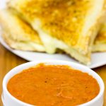 This Tomato Grilled Cheese Soup is what happens when tomato soup meets a grilled cheese sandwich. It's the ultimate comfort food, and it's guaranteed to warm you up on a cold winter day!