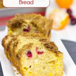Loaded with cranberries and mandarin oranges and topped with a graham cracker crumble, this tasty Cranberry Mandarin Orange Bread is perfect for holiday baking!