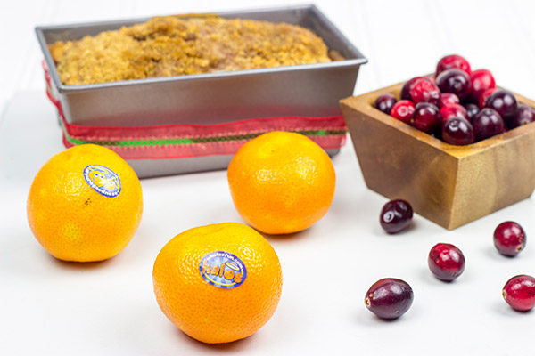 Loaded with cranberries and mandarin oranges and topped with a graham cracker crumble, this tasty Cranberry Mandarin Orange Bread is perfect for holiday baking!