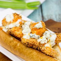 These delicious Buffalo Chicken Hoagies feature baked chicken coated in crispy breadcrumbs and tangy, homemade Buffalo sauce. They're the perfect sandwich for the big game!