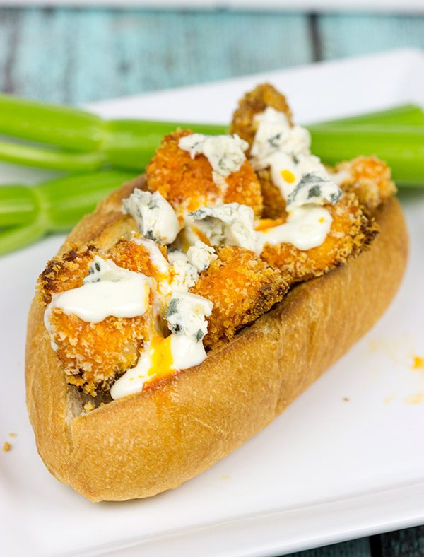 These delicious Buffalo Chicken Hoagies feature baked chicken coated in crispy breadcrumbs and tangy, homemade Buffalo sauce. They're the perfect sandwich for the big game!