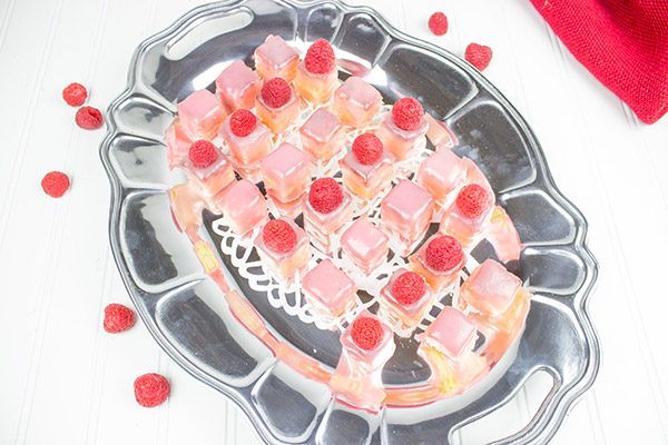 These Raspberry Almond Petit Fours feature layers of decadent almond cake, silky French buttercream and raspberry jam. They're the perfect one-bite sweet treat for your next big party!