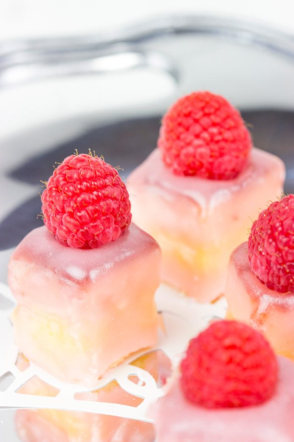These Raspberry Almond Petit Fours feature layers of decadent almond cake, silky French buttercream and raspberry jam. They're the perfect one-bite sweet treat for your next big party!