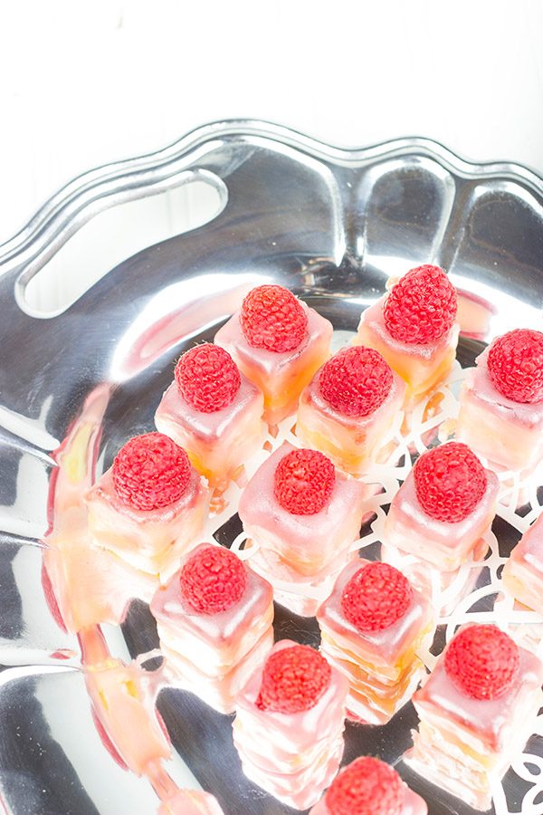 These Raspberry Almond Petit Fours feature layers of decadent almond cake, silky French buttercream and raspberry jam. They're the perfect one-bite sweet treat for your next big party!