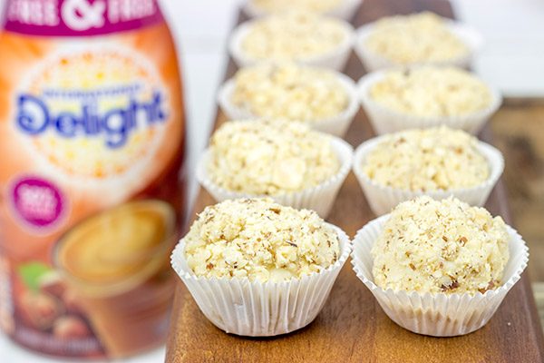 Packed with flavor and then rolled in chopped hazelnuts, these White Chocolate Hazelnut Truffles are a fun sweet treat to serve at your next party!