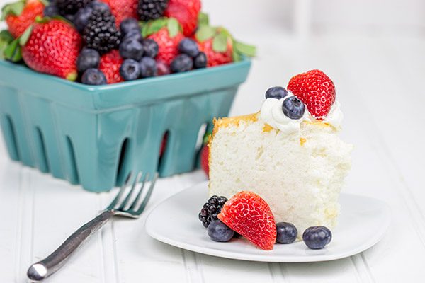 Grab some fresh berries and serve them up a slice of this light and airy Hazelnut Angel Food Cake!