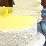 Decadent coconut flakes...sweet vanilla buttercream...tart lemon curd. One slice of this Lemon Coconut Cake will whisk you away to a warm Caribbean island!