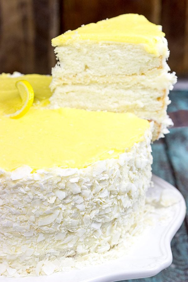 Decadent coconut flakes...sweet vanilla buttercream...tart lemon curd. One slice of this Lemon Coconut Cake will whisk you away to a warm Caribbean island!