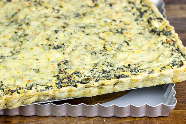 Turn one of your favorite dips into an entree with this tasty Spinach Artichoke Tart!