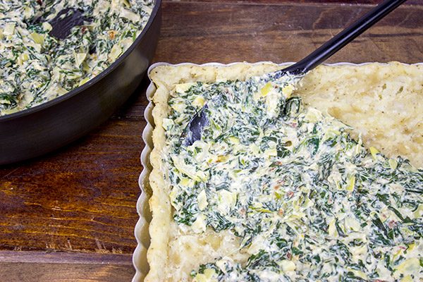 Turn one of your favorite dips into an entree with this tasty Spinach Artichoke Tart!