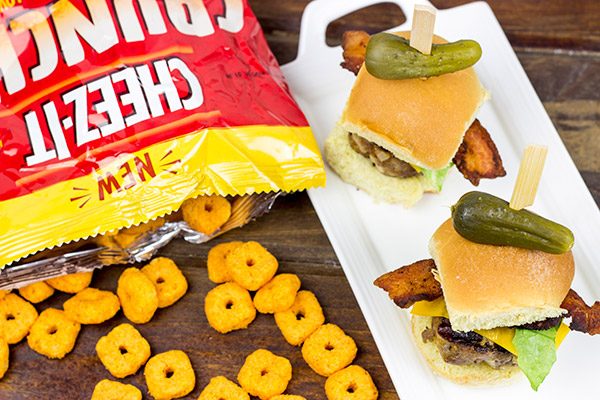 Stuffed with cheese and then topped with more cheese, these Triple Cheddar Bacon Sliders are the perfect snack to serve during the big game!