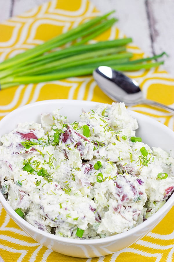 This lightened-up New England Potato Salad packs a flavor punch thanks to a handful of shredded horseradish cheddar cheese. It's a summer picnic classic!